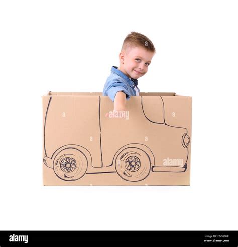 Creative boy playing with cardboard car, isolated on white Stock Photo ...