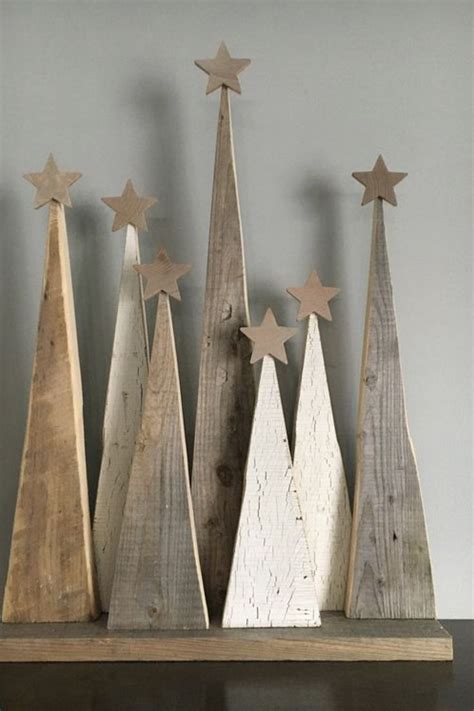 Three Wooden Christmas Trees With Stars On Them