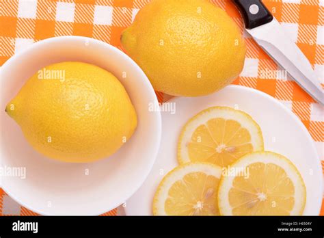 A Slices Of Fresh Yellow Lemon Lemon Pieces In Different Sizes