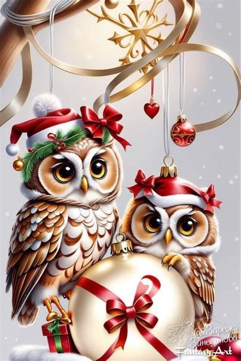 Two Owls Sitting On Top Of A Christmas Ornament