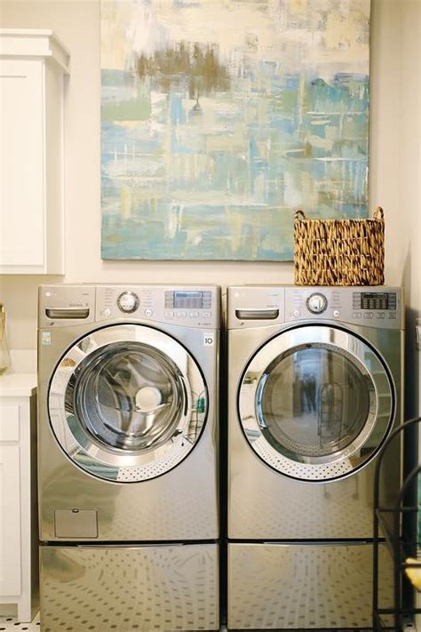 Blue Abstract Art Over Silver Front Load Washer And Dryer