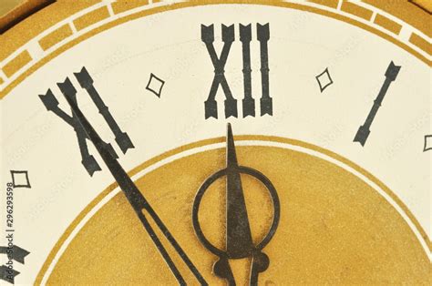 Old clock with roman numerals. Stock Photo | Adobe Stock