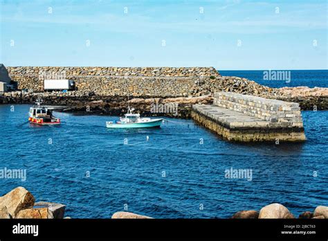 Fishing And Recreational Boats Parked In A Small Harbor Cove Stock