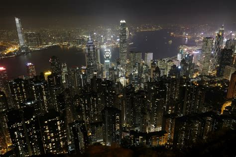 VICTORIA PEAK, HONG KONG- March 12, 2019 Cold foggy evening night view ...