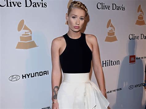 Iggy Azalea Mesmerizes In A Figure Hugging Nude Mini Dress