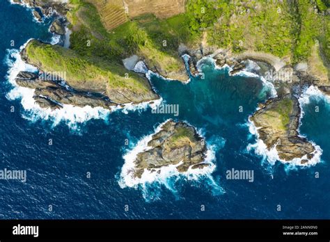 View From Above Stunning Aerial View Of A Green Rocky Cliff Bathed By