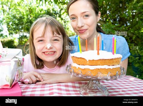 Happy little girl at birthday party Stock Photo - Alamy