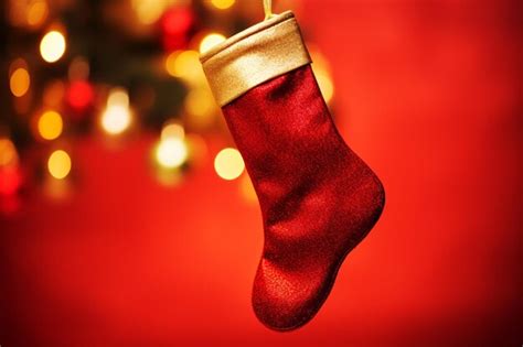 Premium Ai Image Vibrant Red Stocking Hanging From A Festive