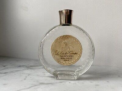 ANCIEN FLACON MONTRE parfum l air du temps Nina Ricci Paris signé by