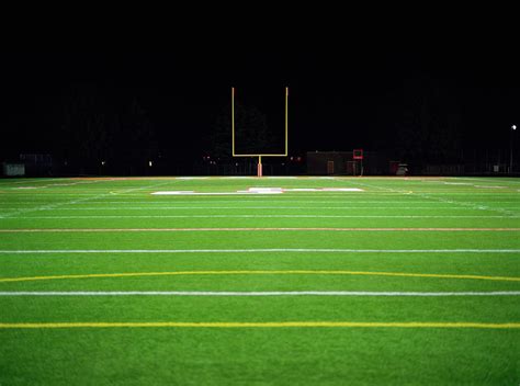 American Football Field At Night by Darrin Klimek