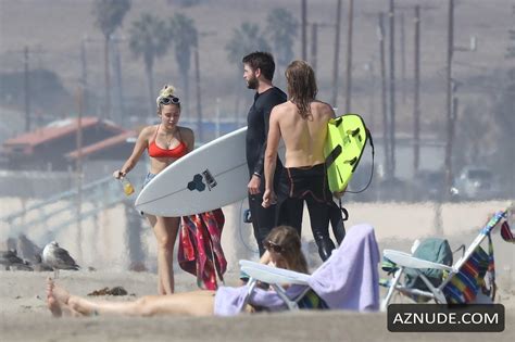 Miley Cyrus Sexy In A Cheeky Red Bikini With Boyfriend Liam Hemsworth In Malibu AZNude