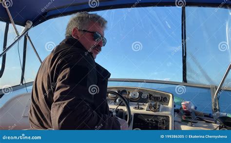 Captain Of The Boat At The Helm Boat Trip On A Boat Along The Avacha