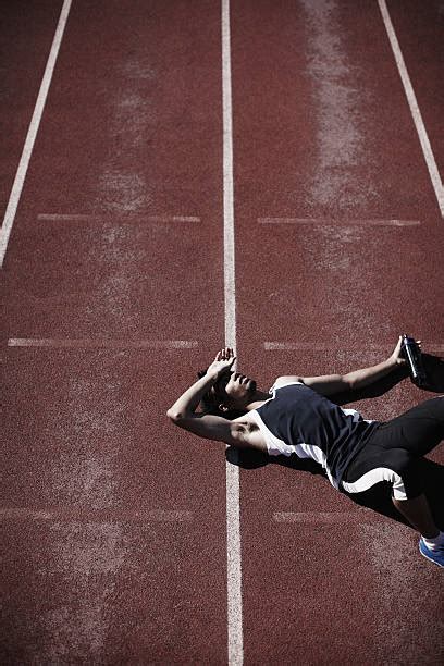 Tired Athlete Man Lying On Running Track Stock Photos Pictures