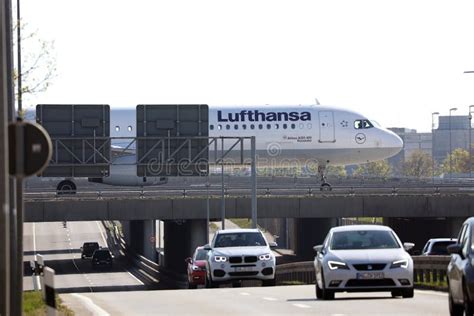 Lufthansa Plane Doing Taxi On Taxiway On The Bridge Editorial