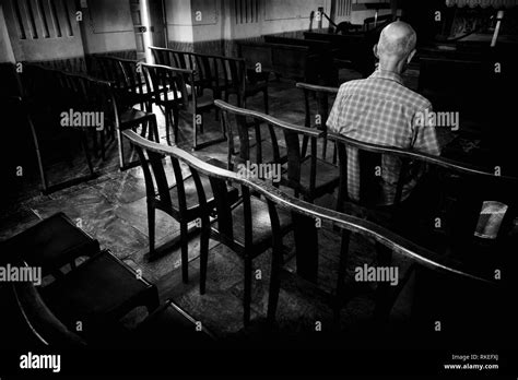 Rear View Of Man Sitting In Church Corte Corsica France Stock Photo