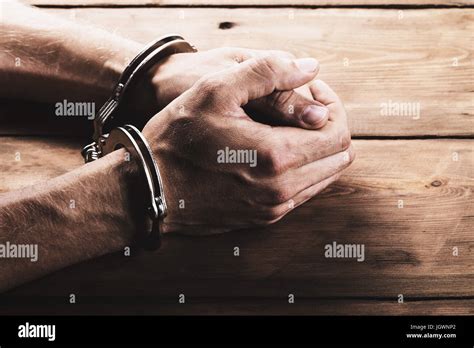 Handcuffs On Hands Hi Res Stock Photography And Images Alamy