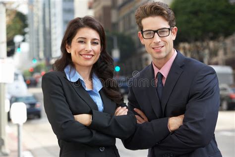 Portrait Of Businessman And Businesswoman Outside Office Stock Image