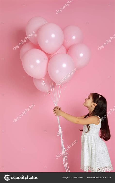 Happy cute little child girl posing with pastel pink air balloons Stock ...