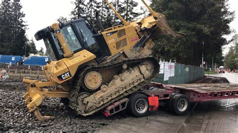 Loading A Cat Dozer Over The Rear Of A Transport Trailer Youtube