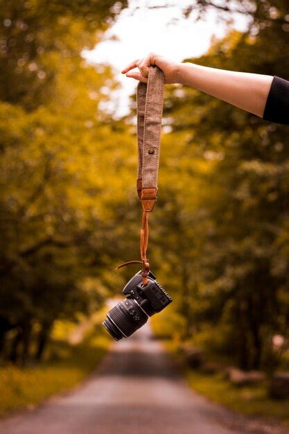 Premium Photo Cropped Hand Holding Camera