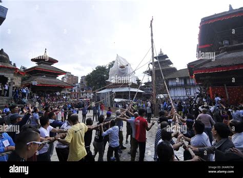 Nepalese Devotees Pulling Rope To Erecting The Long Wooden Log Yo