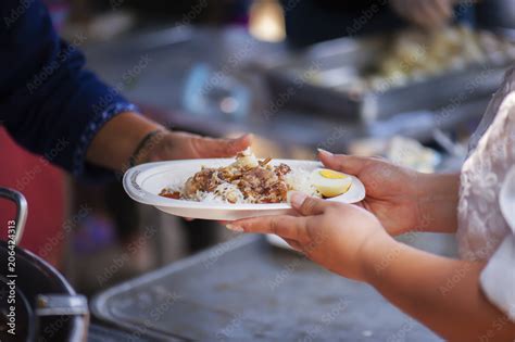 Feeding The Poor Helping Each Other In Society Stock Photo Adobe Stock