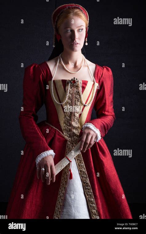 Tudor Woman In Red Dress On Black Background Stock Photo Alamy