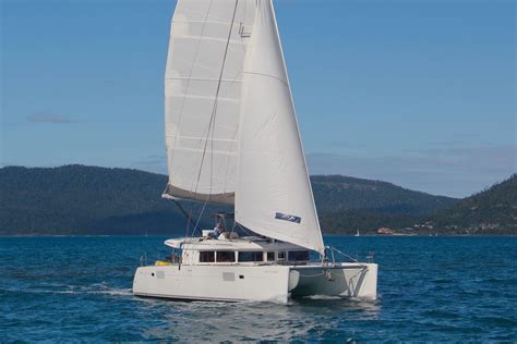 Whitsunday Escape Lagoon 450 sailing catamaran sailing towards mid ...