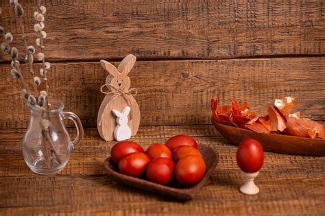 Premium Photo On A Wooden Background Easter Eggs Painted With