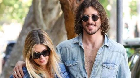 Delta Goodrem and Matthew Copley cuddle at BST Hyde Park - The Celeb Post