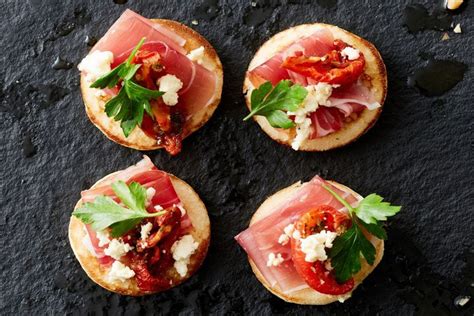 Prosciutto and marinated fetta blinis