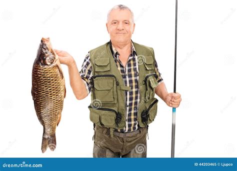 Mature Fisherman Holding Big Fish And Fishing Rod Stock Image Image