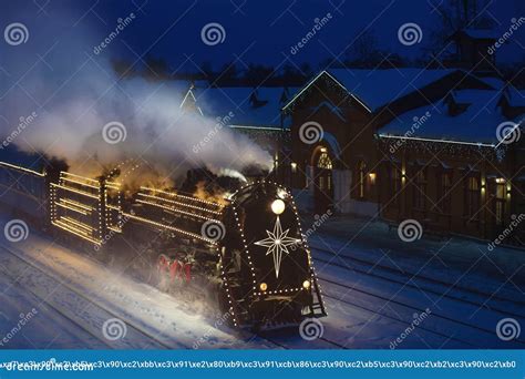 Festively Decorated With Lights Retro Christmas Train On Rails Stock