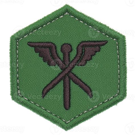 This shows green hexagonal patch with design featuring crossed tools