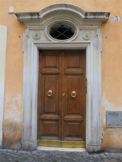 Roman Door With Lovely Oval Window Below The Lintel Door Design