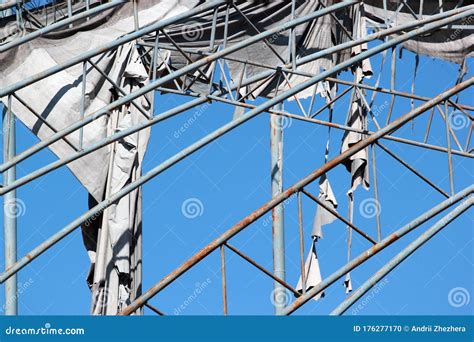 Tattered Cloth on Metal Frame Against Blue Sky Background Stock Photo ...