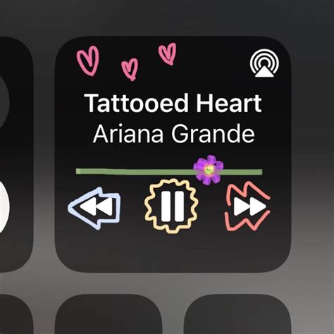 Two Black And White Signs With The Words Tattooed Heart Ariana Grande