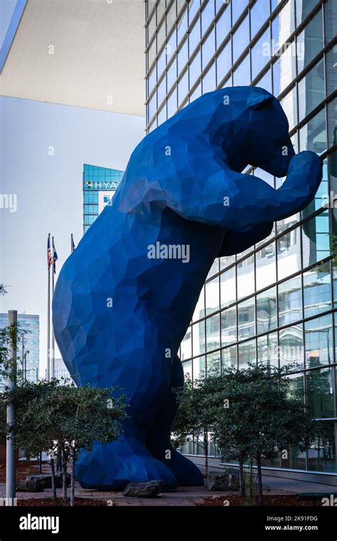 A Statue Of A Big Blue Bear Looking Through The Windows At The Convention Center In Denverusa