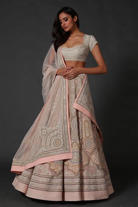 Ivory Lehenga With Floral Paisley Embroidered Motifs And Tassel Detail