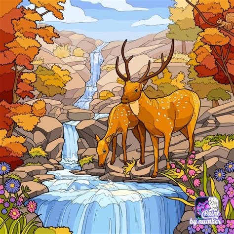 Two Deer Standing Next To Each Other Near A Waterfall With Fall Foliage