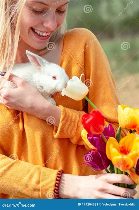 Portrait Of Young Woman Posing With Rabbit Lovely Woman Hold White