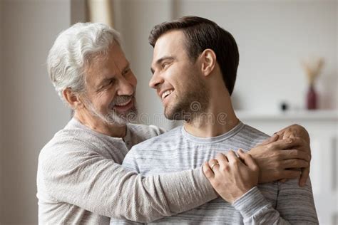 Happy Mature Father Hug Adult Son Showing Love Stock Image Image Of