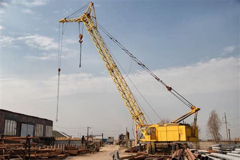 A Large Yellow Crawler Crane Stands At The Bottom Of Reactor Stock