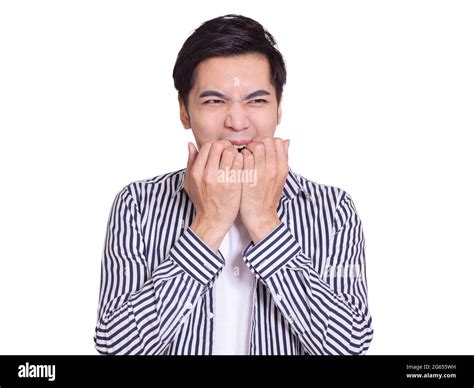 Young Man Showing Surprised Or Worried Expression And Biting His