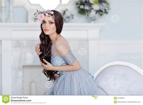 Portrait Of A Beautiful Brunette Girl With Brown Eyes In A Stock Image Image Of Lilac