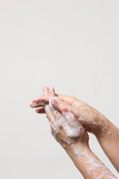 Premium Photo | Person washing hands with soap