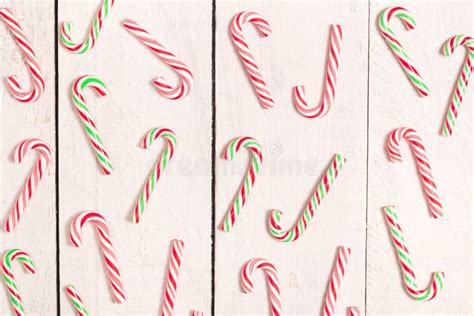 Lots Of Candy Canes Scattered On White Rustic Wooden Desk Chtistmas