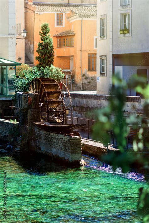 Vertical View Of Water Wheels In Sunny Day On River Sorgue In Fontaine