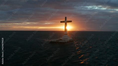 Catholic Cross In Sunken Cemetery In The Sea At Sunset Aerial Drone