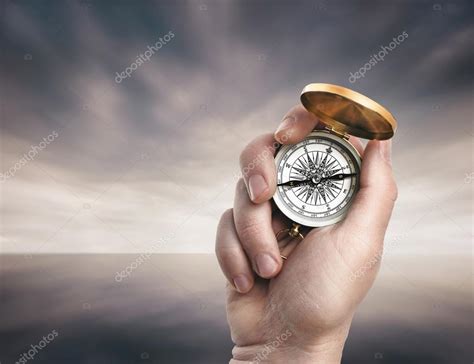 Hand Holding Compass Stock Photo By Olegkrugllyak